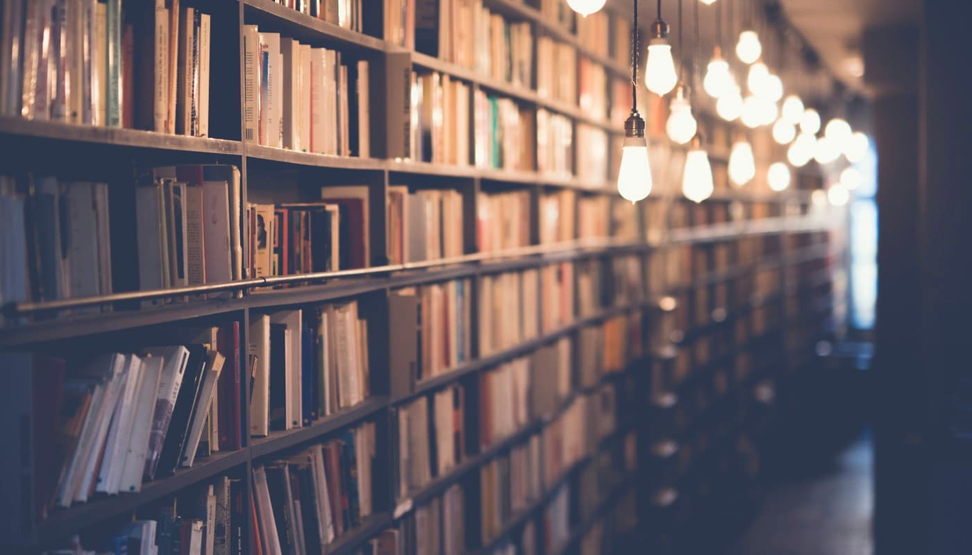 Bookshelves and hanging lights in a library